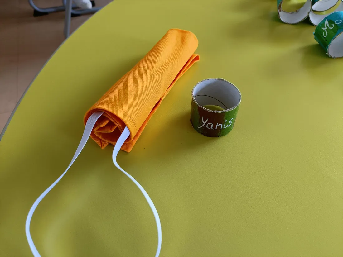 Serviettes et porte-serviettes pour les écoliers tullistes