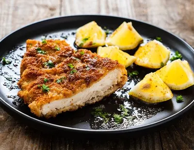 Escalope viennoise avec curry et coriandre