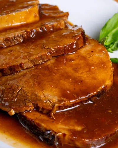 Rôti de porc et sa sauce caramélisée