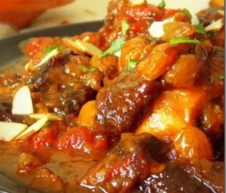 Tajine de cuisses de poulet, amandes et abricots frais