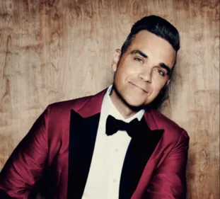 Robbie Williams malade : il annonce une mauvaise nouvelle ! (VIDEO)